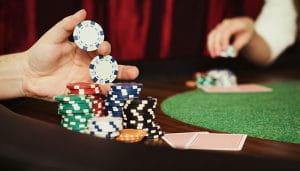 UK Casino Table with Stacks of Chips and Cards