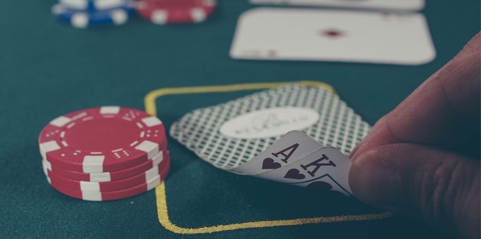 Image of casino chips and cards on a table